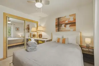 Bedroom 2 — queen bed and a desk, upstairs.