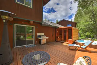 The back deck — sauna, hot tub, grill and loungers.