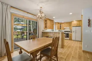 The dining table under the antler chandelier.