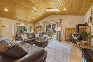 The living room — gas fireplace and a big smart TV.