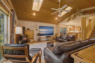 The living room toward the kitchen and stairs.