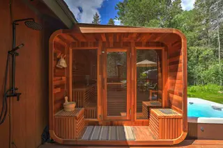 The redwood sauna, with the outdoor shower beside it.